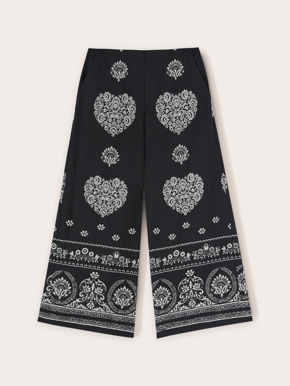Cropped trousers with ethnic pattern