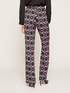 Geometric patterned flared trousers image number 1