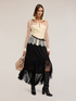 Asymmetrical flared skirt in plumetis image number 3