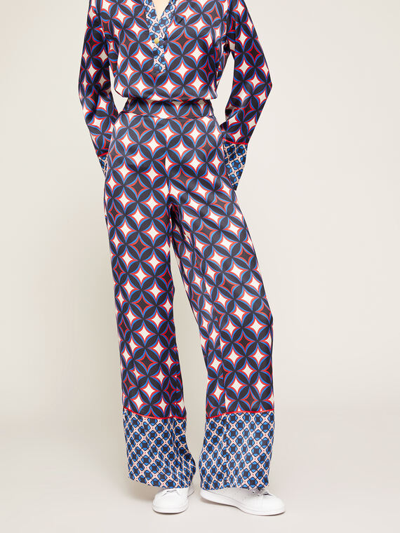 Pantalones modelo palazzo de raso con estampado geométrico
