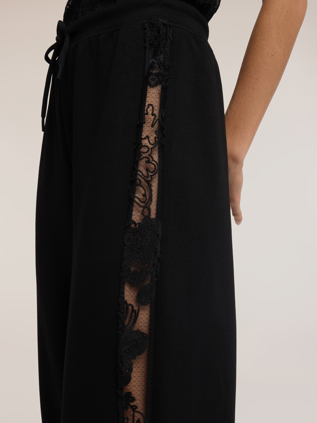 Jogging pants with lace inserts image number 3