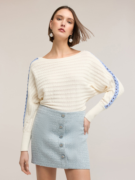 Oversized sweater with openwork inserts on the sleeves