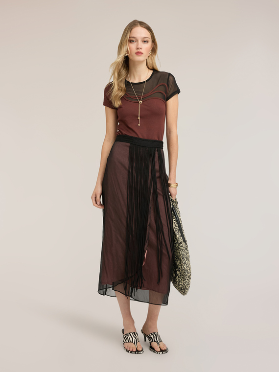 Long pleated skirt with fringes