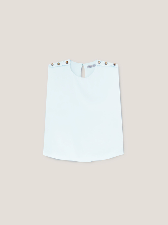 Sleeveless blouse with button feature