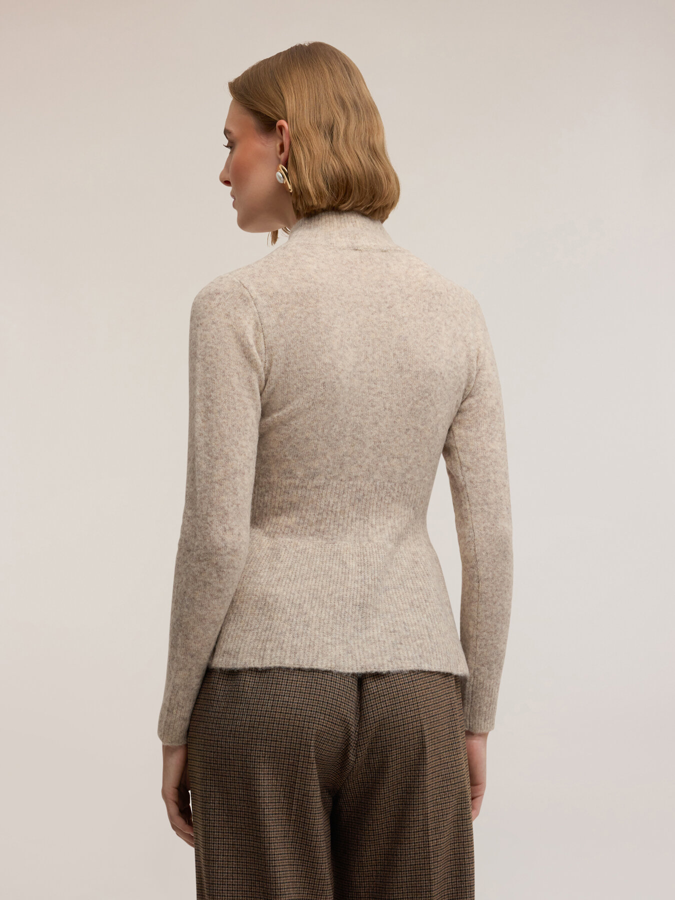Maglia dolcevita con taglio peplo image number 1