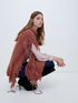 Knit cape with cable pattern and fringes image number 2