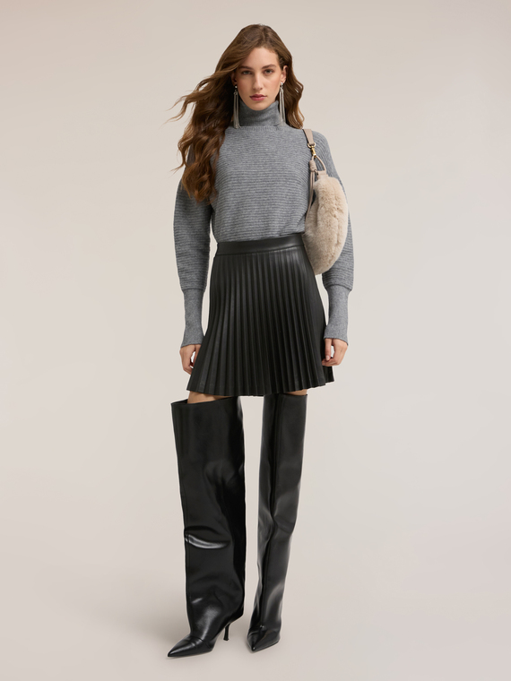 Short pleated skirt in coated fabric