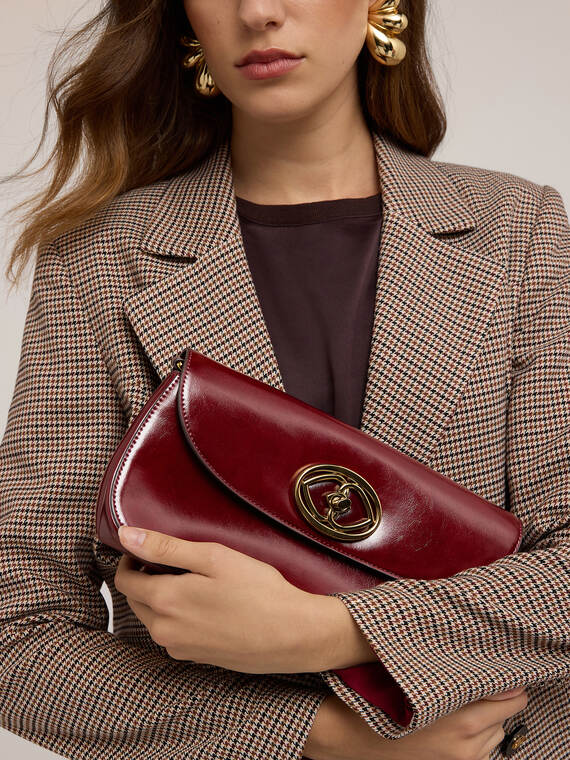 Coated fabric clutch