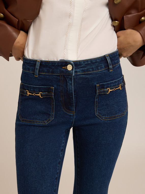 Flare jeans with metal toggles