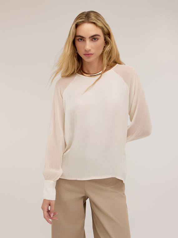 Blouse with sheer raglan sleeves