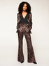 Geometric patterned chenille flared trousers image number 0