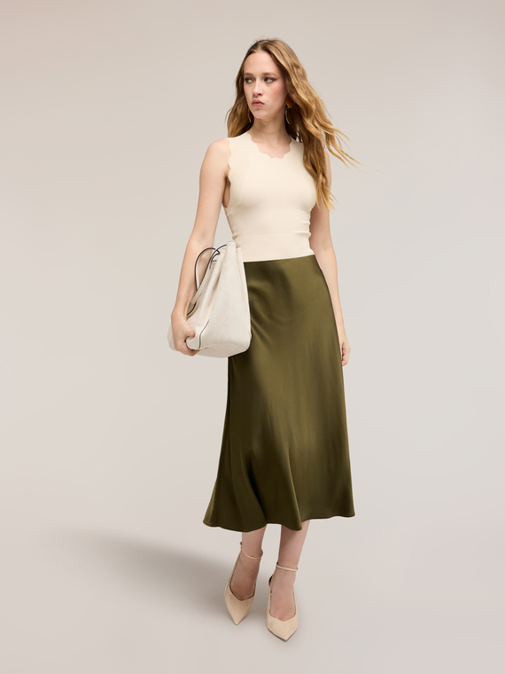 Sweater with scalloped edge and back cut-out