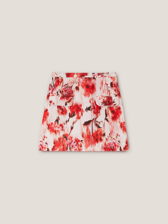 Short floral skirt with flap pockets