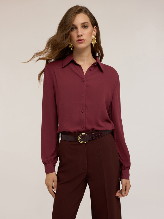 Shirt with covered buttons