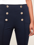 High-waisted slim trousers with button feature image number 2