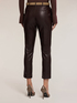 Pantalones slim fit en tejido revestido image number 1