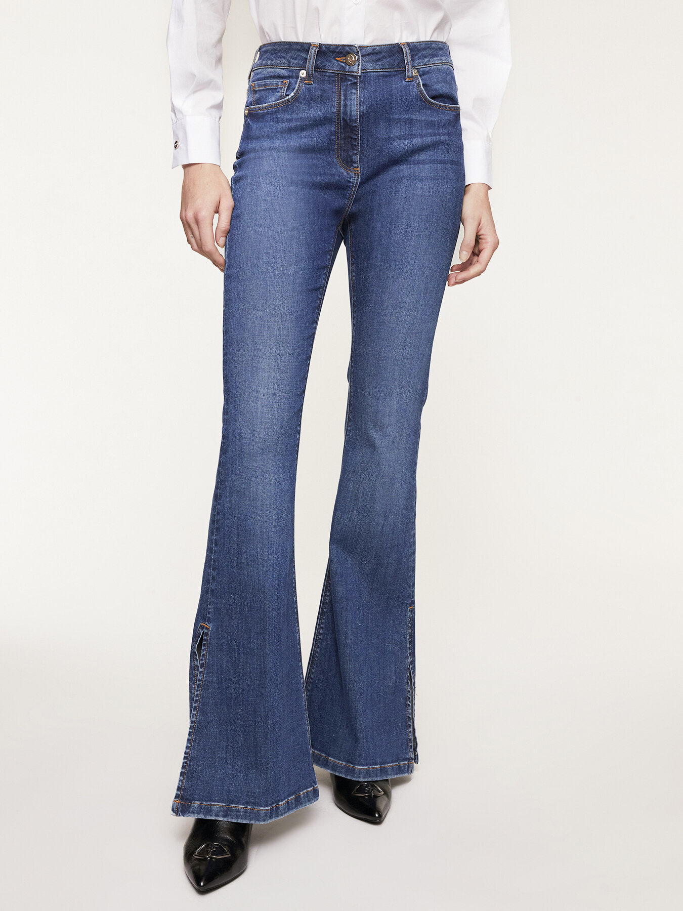 Flared jeans with slit hem image number 0