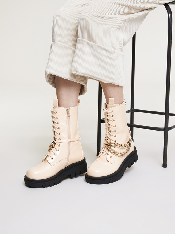 Lace-up combat boots with chains