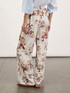 Pantalon palazzo fluide &agrave; motif fleuri image number 1
