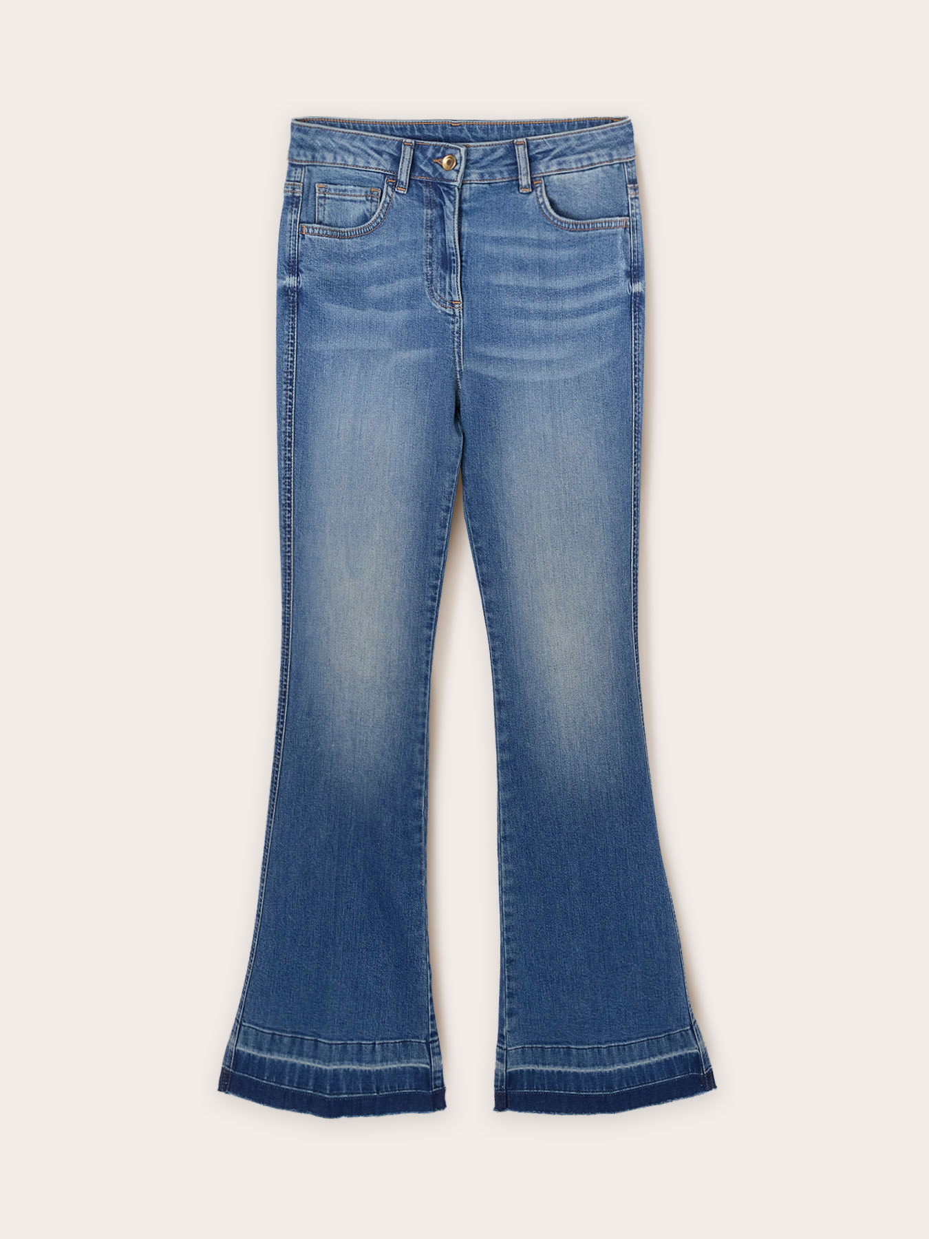 Flared jeans with frayed hem