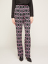 Geometric patterned flared trousers image number 0
