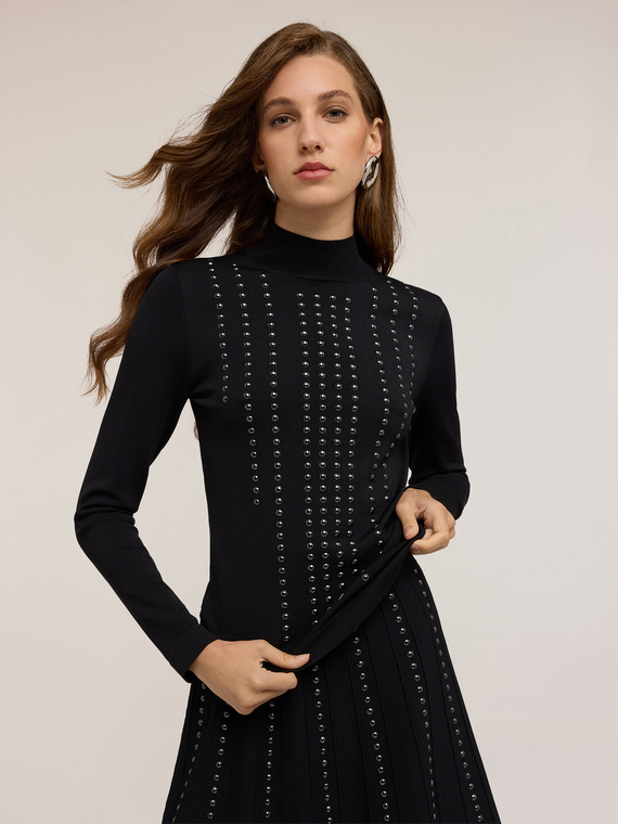 Turtleneck sweater with appliqu&eacute;s