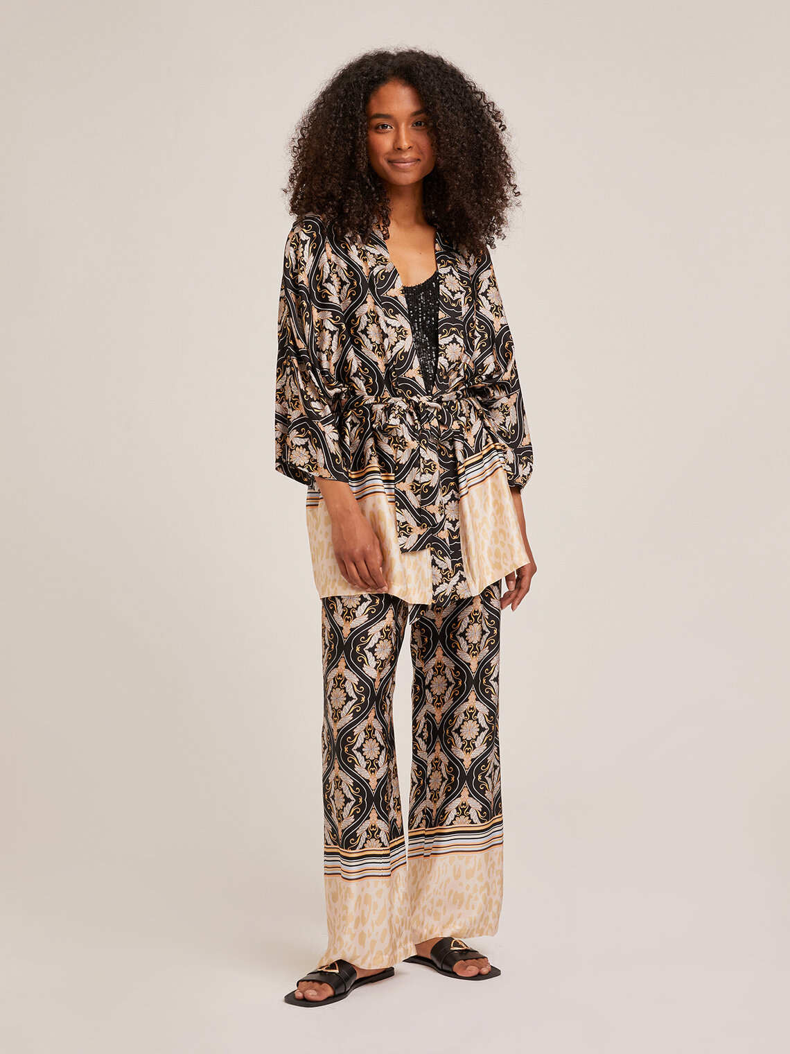 Pantaloni larghi con fusciacca fantasia etnica - Motivi.com