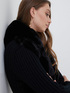 Faux fur winter jacket with knitted sleeves image number 2
