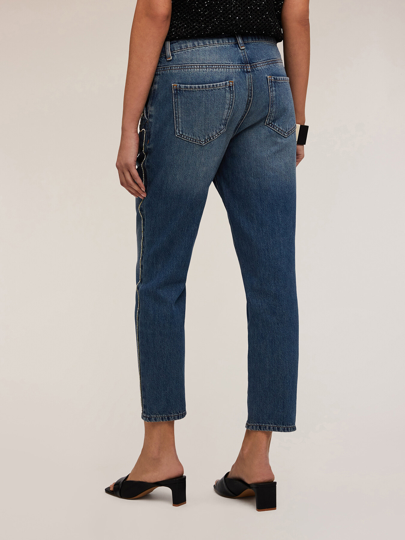 Jeans with button feature and metal chain image number 1