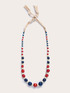 Long necklace with wooden and raffia beads image number 1